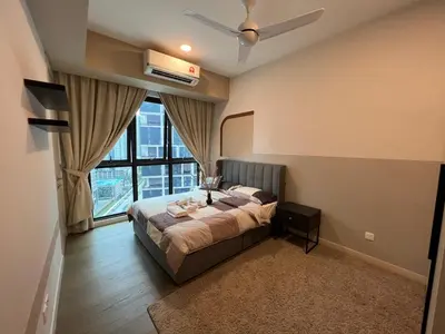 a bedroom with a bed and a large window at OOAK residence in Kuala Lumpur