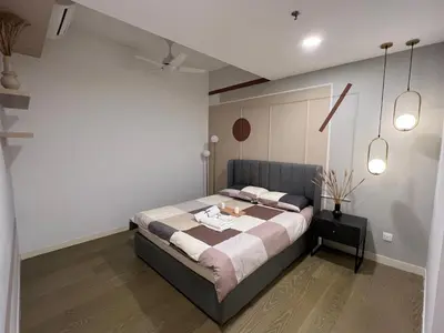 a bedroom with a large bed in a room at OOAK residence in Kuala Lumpur