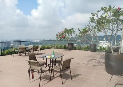 a group of tables and chairs on a patio at OOAK residence in Kuala Lumpur