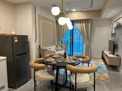 a kitchen and dining room with a table and chairs at OOAK residence in Kuala Lumpur