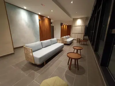 a living room with a couch and chairs and tables at The Pano Jalan Ipoh Sentul by Kenangan Homes in Kuala Lumpur