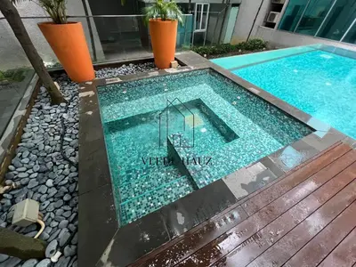 a swimming pool with a sign that reads weird mix at Mercu Summer Suites KLCC by Veedu Hauz in Kuala Lumpur