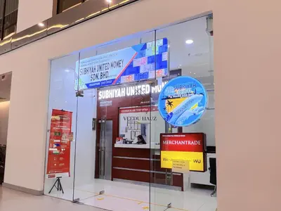 a store window with a sign in front of it at Mercu Summer Suites KLCC by Veedu Hauz in Kuala Lumpur