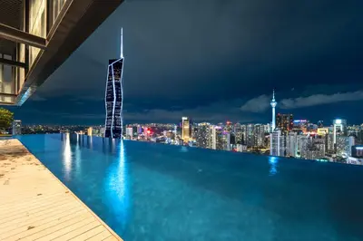 a view of a city skyline at night at Harmony Luxury Suites At Lucentia Bukit Bintang City Center in Kuala Lumpur