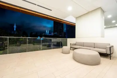 a living room with a couch and a table at Harmony Luxury Suites At Lucentia Bukit Bintang City Center in Kuala Lumpur