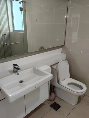 a bathroom with a sink and a toilet and a mirror at 703 KLCC 5 minutes to Alor Street Ceylon Pavilion 3 Room Apt for 10 Pax in Kuala Lumpur