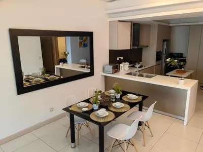 a kitchen and dining room with a table and chairs at 703 KLCC 5 minutes to Alor Street Ceylon Pavilion 3 Room Apt for 10 Pax in Kuala Lumpur