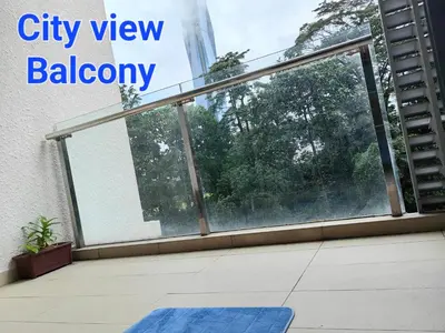 a city view balcony with a sliding glass window at 703 KLCC 5 minutes to Alor Street Ceylon Pavilion 3 Room Apt for 10 Pax in Kuala Lumpur