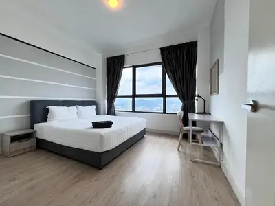 a bedroom with a bed and a desk and a window at Arte Plus Ampang By The Relaxstay in Kuala Lumpur
