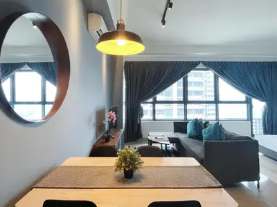 a living room with a table and a couch at Arte Plus Ampang By The Relaxstay in Kuala Lumpur