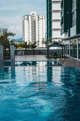 a large swimming pool in a city with tall buildings at Ampang 2-4 pax Studio AmpPoint in Ampang