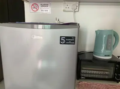 a small refrigerator in a room with a blender at Ampang 2-4 pax Studio AmpPoint in Ampang