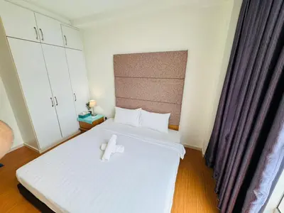 a bedroom with a bed with two white pillows at Bintang Goldhill Guest House in Kuala Lumpur