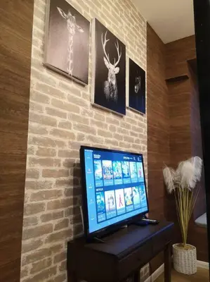 a computer monitor sitting on a desk in a room at Romantic Log Cabin 2 - Heart of KL, near KLCC/KL Tower in Kuala Lumpur