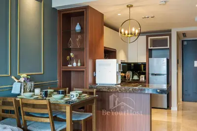 a kitchen and dining room with a table and chairs at Anggun Residences Luxury Suites KL City Center in Kuala Lumpur