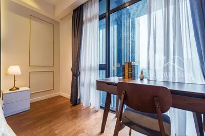 a bedroom with a desk and a window at Anggun Residences Luxury Suites KL City Center in Kuala Lumpur