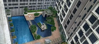 an overhead view of a swimming pool in the middle of a building at Cozy Apartment with Jacuzzi and Sauna at 188 Suites Klcc in Kuala Lumpur
