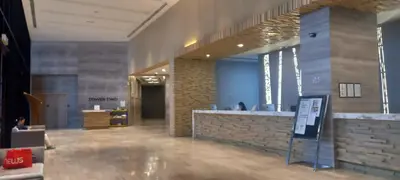 a lobby with a reception counter in a building at Cozy Apartment with Jacuzzi and Sauna at 188 Suites Klcc in Kuala Lumpur