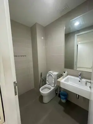 a bathroom with a toilet and a sink and a mirror at Binjai 8 Premium Soho, KLCC, nearby LRT by EC in Kuala Lumpur