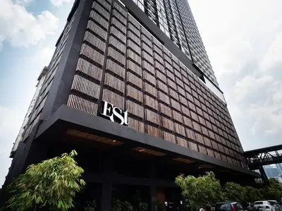 a tall building with the rst sign on it at KLSentral-Bangsar-MidValley-2-10pax-Netflix-Balcony-Super Fast Internet in Kuala Lumpur